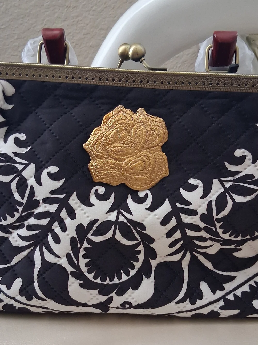 Black & White Quilted Floral Frame Clutch with Gold Rose Accent